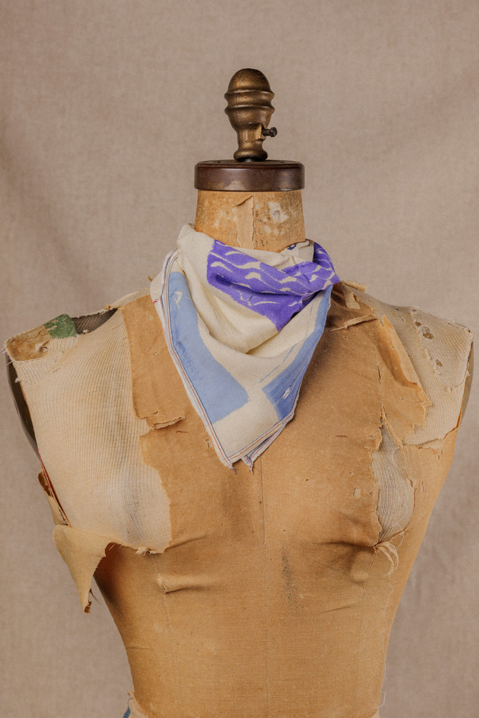 a nautical themed bandana displayed around the neck of a mannequin