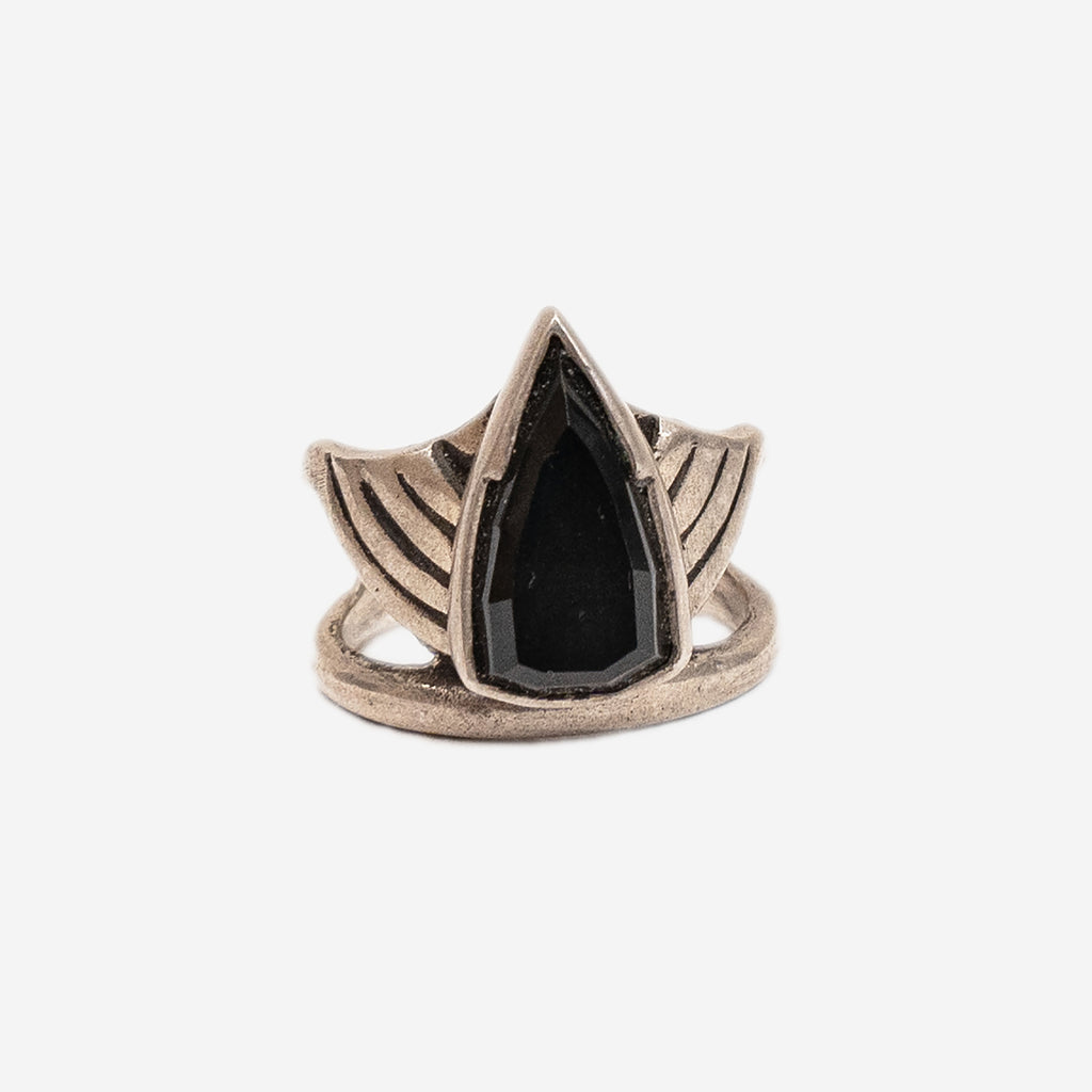 front view of a silver ring with a black stone